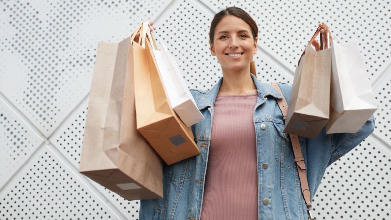 woman holding new shopping clothes